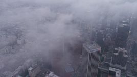 4K aerial stock footage of skyscrapers coverd in marine layer, twilight, Downtown Los Angeles Aerial Stock Footage | AX44_040