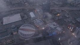 4K aerial stock footage of Staples Center and Nokia Theater below marine layer, Downtown Los Angeles, twilight Aerial Stock Footage | AX44_044