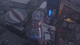 4K aerial stock footage of a wide shot of Staples Center and Nokia Theater, Downtown Los Angeles, twilight Aerial Stock Footage | AX44_046