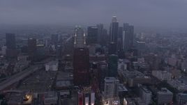 4K aerial stock footage of skyscrapers through marine layer, Downtown Los Angeles, twilight Aerial Stock Footage | AX44_047
