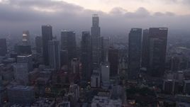 4K aerial stock footage of a marine layer hanging over skyscrapers, Downtown Los Angeles, twilight Aerial Stock Footage | AX44_051
