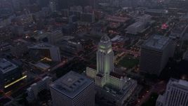 4K aerial stock footage orbiting City Hall revealing skyline, Downtown Los Angeles, twilight Aerial Stock Footage | AX44_052