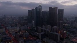 4K aerial stock footage approaching City Hall and revealing skyline, Downtown Los Angeles, twilight Aerial Stock Footage | AX44_053