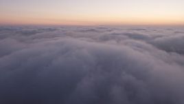 4K aerial stock footage flying over marine layer, Los Angeles twilight Aerial Stock Footage | AX44_055