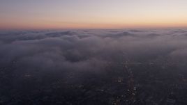 4K aerial stock footage flying over marine layer, Los Angeles, twilight Aerial Stock Footage | AX44_056
