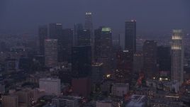 4K aerial stock footage approaching city through marine layer, Downtown Los Angeles, twilight Aerial Stock Footage | AX44_057