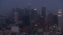 4K aerial stock footage approaching skyscrapers, Downtown Los Angeles, twilight Aerial Stock Footage | AX44_058