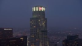 4K aerial stock footage orbiting top of US Bank Tower, Downtown Los Angeles, twilight Aerial Stock Footage | AX44_059