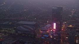 4K aerial stock footage approaching Staples Center panning to The Ritz-Carlton, Los Angeles, twilight Aerial Stock Footage | AX44_060