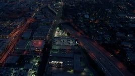 4K aerial stock footage flying over light traffic on an interstate, Los Angeles, twilight Aerial Stock Footage | AX44_061