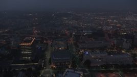 4K aerial stock footage flying by skyscrapers revealing Walt Disney Concert Hall, Los Angeles, twilight Aerial Stock Footage | AX44_066