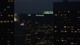 4K aerial stock footage of flying by skyscrapers with lights in the windows, Downtown Los Angeles, twilight Aerial Stock Footage | AX44_076E