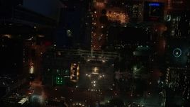 4K aerial stock footage of a bird's eye of city streets and buildings, Downtown Los Angeles, night Aerial Stock Footage | AX44_084E