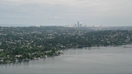 5K aerial stock footage of skyline seen from lakefront homes, Rainier Beach, Seattle, Washington Aerial Stock Footage | AX45_002