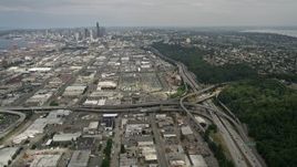 5K aerial stock footage tilting from Interstate 5 to reveal warehouse buildings and Downtown Seattle, Washington Aerial Stock Footage | AX45_014