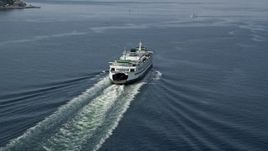 5K aerial stock footage tracking a ferry sailing across Elliott Bay, Seattle, Washington Aerial Stock Footage | AX45_023E
