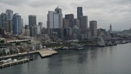 5K aerial stock footage of Downtown Seattle skyline and Central Waterfront seen from Elliott Bay, Washington Aerial Stock Footage | AX45_030E