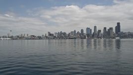5K aerial stock footage tilting up from Elliott Bay to reveal Downtown Seattle skyline, Washington Aerial Stock Footage | AX45_039