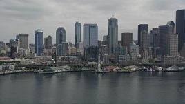 5K aerial stock footage approaching the Seattle Aquarium, Great Wheel and Downtown Seattle skyline, Washington Aerial Stock Footage | AX45_048