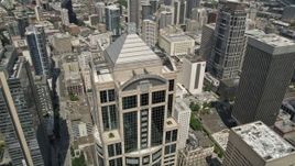 5K aerial stock footage tilting to reveal and track 1201 Third Avenue Tower in Downtown Seattle, Washington Aerial Stock Footage | AX45_051