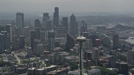 5K aerial stock footage orbiting top of the Space Needle to reveal the Downtown Seattle skyline, Washington Aerial Stock Footage | AX45_055
