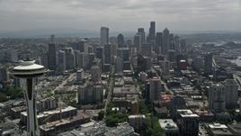 5K aerial stock footage flying by Space Needle to approach the Downtown Seattle skyline, Washington Aerial Stock Footage | AX45_056E