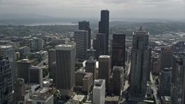 5K aerial stock footage flying over high-rises to approach Columbia Center in Downtown Seattle, Washington Aerial Stock Footage | AX45_058E