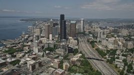 5K aerial stock footage tilting from light traffic on the I-5 Express to reveal skyscrapers in Downtown Seattle, Washington Aerial Stock Footage | AX45_064E