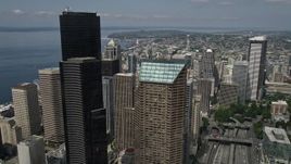 5K aerial stock footage flying over downtown buildings to approach the Space Needle, Downtown Seattle, Washington Aerial Stock Footage | AX45_066