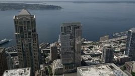 5K aerial stock footage flying over Russell Investments Center, tilt to Seattle Great Wheel on Central Waterfront, Downtown Seattle, Washington Aerial Stock Footage | AX45_087E