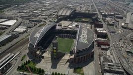 5K aerial stock footage flying by CenturyLink Field, with a view of the field inside the stadium, Downtown Seattle, Washington Aerial Stock Footage | AX45_091E