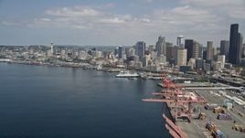5K aerial stock footage approaching the downtown skyline and Waterfront piers from the port, Downtown Seattle, Washington Aerial Stock Footage | AX45_095