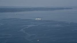 5K aerial  video flyby a ferry sailing on Puget Sound, Washington Aerial Stock Footage | AX45_119