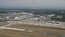 5K aerial stock footage of airliners parked near the Boeing Factory at Paine Field airport, Everett, Washington Aerial Stock Footage | AX45_133