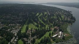 5K aerial stock footage tilting to a bird's eye view of Inglewood Golf Club by Lake Washington, Kenmore, Washington Aerial Stock Footage | AX46_016