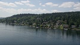 5K aerial stock footage of flying by lakeside homes with docks on the lake, Mercer Island, Washington Aerial Stock Footage | AX46_048