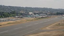 5K aerial stock footage of airliners parked at a small airport, Renton Municipal Airport, Washington Aerial Stock Footage | AX46_054