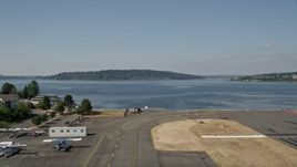 5K aerial stock footage take off from Renton Municipal Airport and fly over Lake Washington toward Mercer Island, Washington Aerial Stock Footage | AX47_001