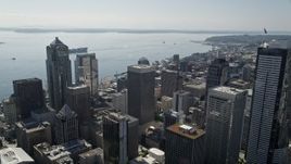 5K aerial stock footage approach and fly over Rainier Tower, skyscrapers and high-rises toward the bay in Downtown Seattle, Washington Aerial Stock Footage | AX47_020E