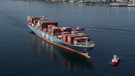 5K aerial stock footage orbit a Cargo Ships and a pair of Tugboats on Elliott Bay, Seattle Aerial Stock Footage | AX47_029