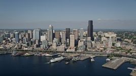 5K aerial stock footage approach Downtown Seattle skyline and fly over the Seattle Ferry Terminal on the Waterfront toward Central Seattle, Washington Aerial Stock Footage | AX47_036E