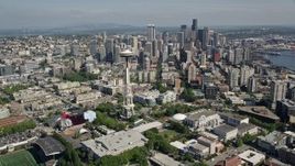 5K aerial stock footage fly over Seattle Center and by Space Needle to approach skyscrapers in Downtown Seattle, Washington Aerial Stock Footage | AX47_053E