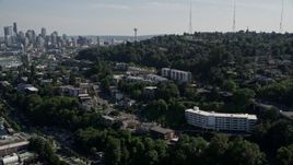 5K aerial stock footage approach and fly over bridge spanning Lake Union, reveal Downtown Seattle skyline, Washington Aerial Stock Footage | AX47_068