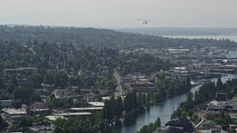 5K aerial stock footage of tracking a seaplane flying over Queen Anne, Seattle, Washington Aerial Stock Footage | AX47_072