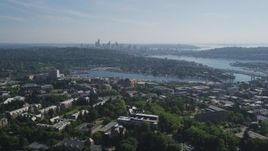 5K aerial stock footage of Portage Bay, Lake Union, and the Downtown Seattle skyline seen from University of Washington campus Aerial Stock Footage | AX47_089