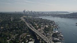 5K aerial stock footage fly over the Ship Canal Bridge to approach the Downtown Seattle skyline and Lake Union, Washington Aerial Stock Footage | AX47_090