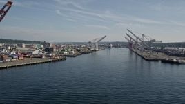 5K aerial stock footage flyby cargo cranes lining the waterway at Harbor Island, Seattle, Washington Aerial Stock Footage | AX47_099E