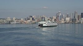 5K aerial stock footage descend and flyby a ferry sailing toward the Downtown Seattle skyline, Washington Aerial Stock Footage | AX47_116E