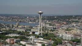 5K aerial stock footage fly by downtown buildings and Seattle Waterfront piers to reveal the Space Needle in Downtown Seattle, Washington Aerial Stock Footage | AX47_125E
