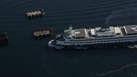 5K aerial stock footage of ferry approaching the Seattle Ferry Terminal in Downtown Seattle, Washington Aerial Stock Footage | AX47_137E